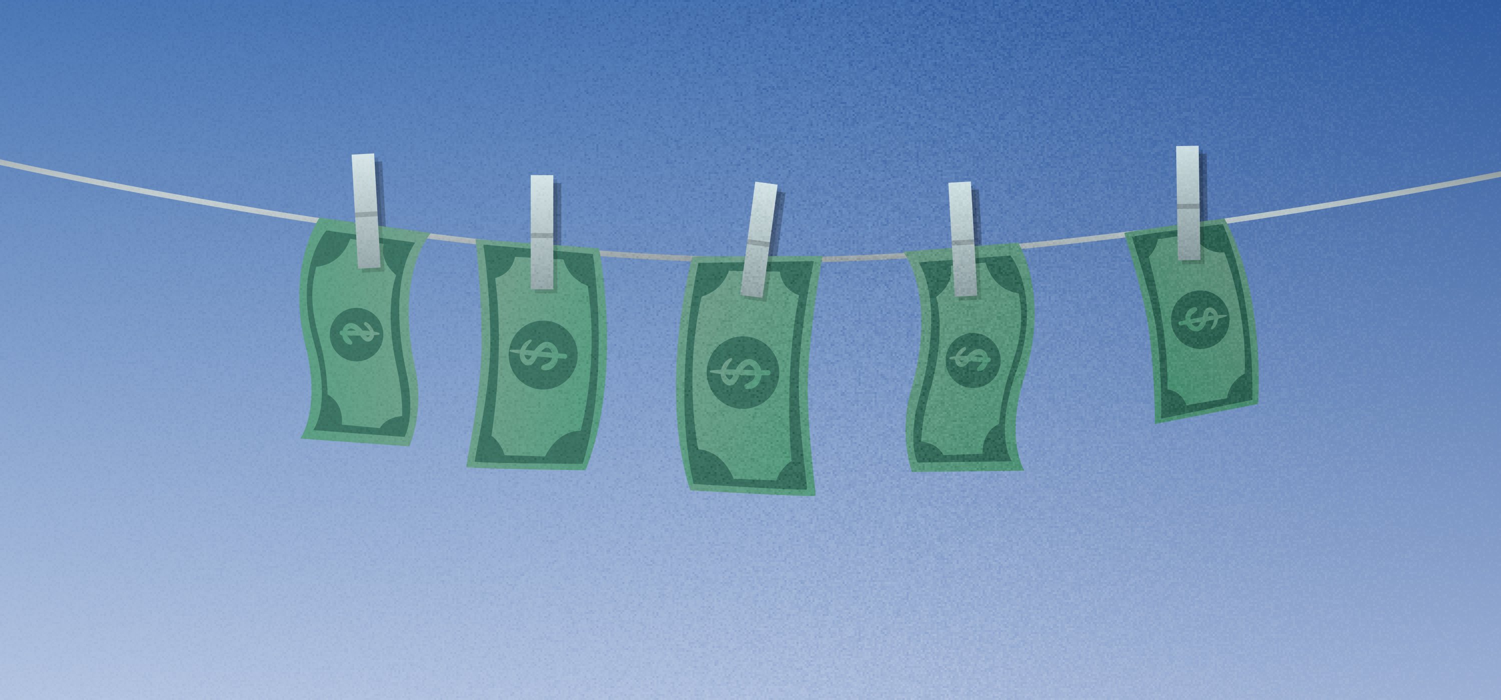 Dollar bills hanging on a clothesline by clothespins